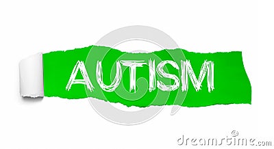 The word AUTISM appearing behind green torn paper Stock Photo