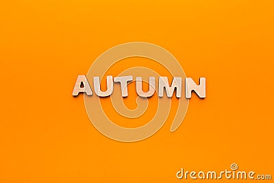 Word Autumn on orange background Stock Photo