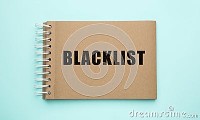 Word Blacklist written in notepad on light blue background, top view Stock Photo
