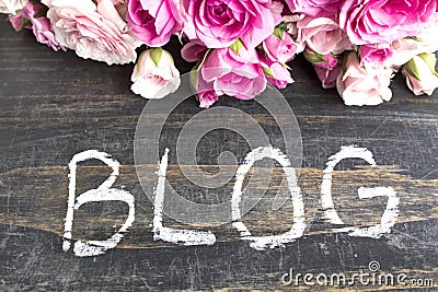 Word Blog with Pink Roses on a Rustic Wooden Background Stock Photo