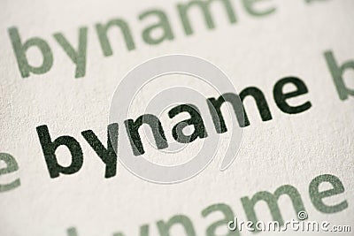 Word byname printed on paper macro Stock Photo