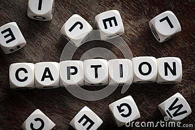 Word caption on toy cubes Stock Photo