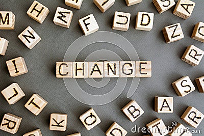 The word change wooden cubes with burnt letters Stock Photo