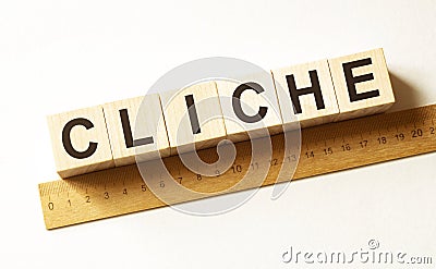 Word CLICHE made with wood building blocks Stock Photo