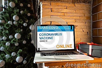 The word coronavirus Vaccination on the display of a laptop. Editorial Stock Photo
