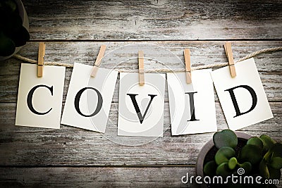 The Word COVID Concept Printed on Cards Stock Photo