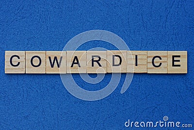 Word cowardice made from brown wooden letters Stock Photo