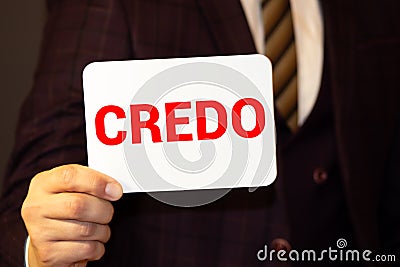 word credo printed on white paper macro Stock Photo