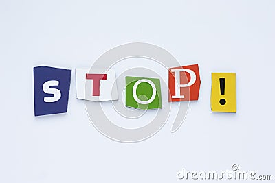 Word from cut letters STOP on white background. A word writing text showing STOP! Concept of the ban. White paper texture. Stock Photo