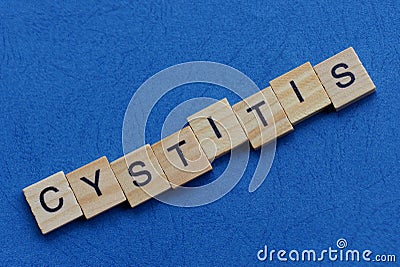 Word cystitis made from brown wooden letters Stock Photo