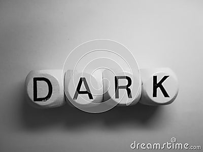 Word dark spelled on wooden dice Stock Photo