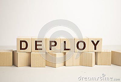 Word DEPLOY made with wood building blocks Stock Photo