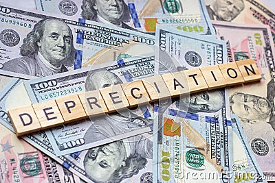 The word depreciation on dollar usa background. Stock Photo