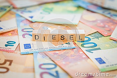 The word Diesel on banknotes Euro notes written with wooden cubes Stock Photo