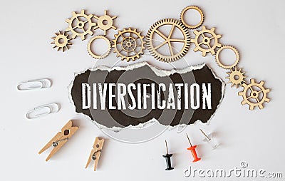 word Diversification on black paper. Business concept Stock Photo
