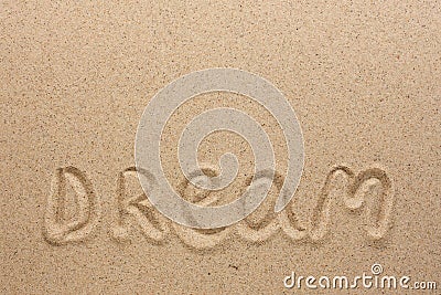 The word dream written on the sand Stock Photo