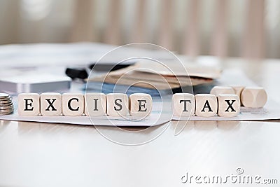 Word EXCISE TAX is composed of wooden letters. Stock Photo