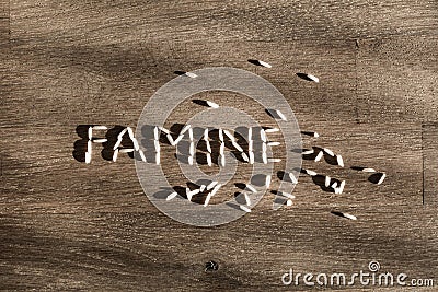 Word famine made of rice. Stock Photo