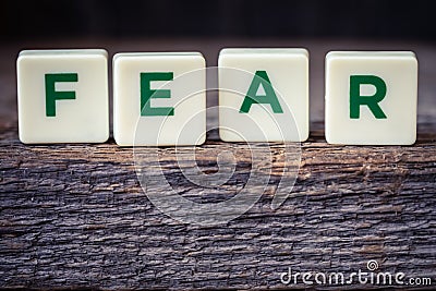 Word Fear, letters on the rustic background Stock Photo