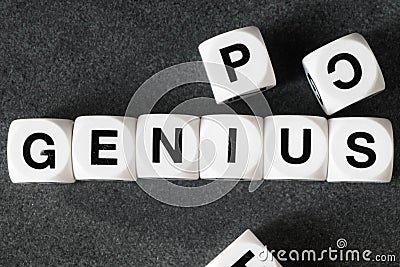 Word genius on toy cubes Stock Photo