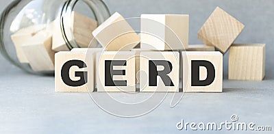 Word GERD Gastroesophageal reflux disease from cubes. Stock Photo