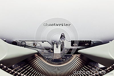 The word ghost writer typed on the paper with a vintage typewriter Stock Photo