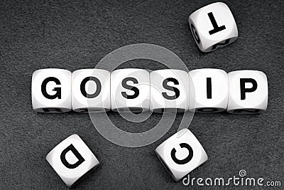 Word gossip on toy cubes Stock Photo