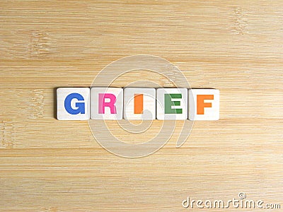 Word Grief on wood background Stock Photo