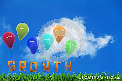 The word growth on grass tied up to colorful balloons with business targets Stock Photo