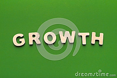 Word Growth spelled with wooden letters Stock Photo