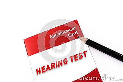 Word HEARING TEST on medical check up appointment card Stock Photo