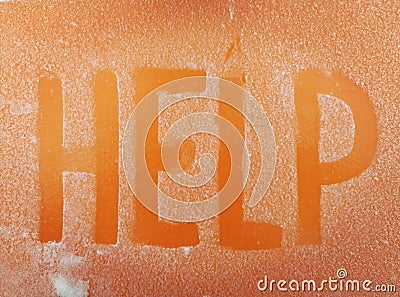 Word HELP written by hand on an orange metal surface covered with hoarfrost. Editorial Stock Photo