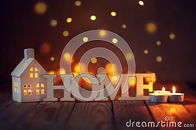 Word home of the decorative letters on wooden table with candle Stock Photo