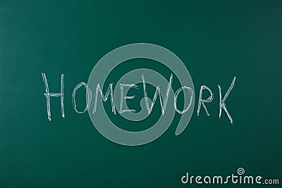 Word HOMEWORK written with chalk on chalkboard Stock Photo