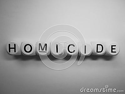 Word homicide on wooden dice Stock Photo