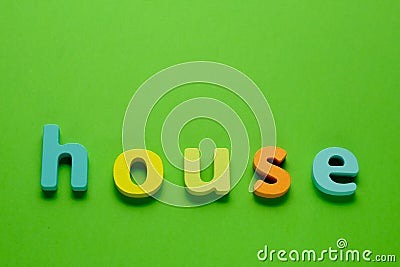 Word HOUSE on green background. Learning the English alphabet and language.The concept of education, school, kindergarten Stock Photo