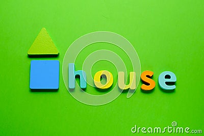 Word HOUSE on green background. Learning the English alphabet and language.The concept of education, school, kindergarten Stock Photo