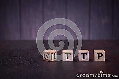 The word http on wooden cubes, on a dark background, light wooden cubes signs, symbols signs Stock Photo