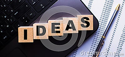 The word IDEAS is written on wooden cubes near the handle Stock Photo