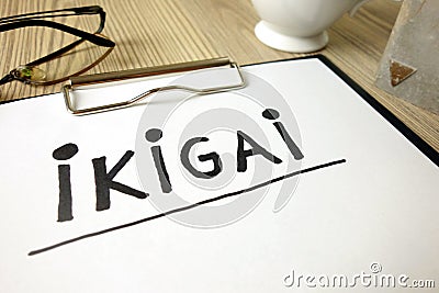 Word ikigai handwritten in notepad with accessories Stock Photo