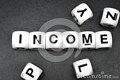 Word income on toy cubes Stock Photo