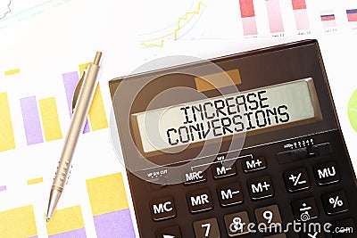 Word increase conversions on calculator. Business and tax concept Stock Photo