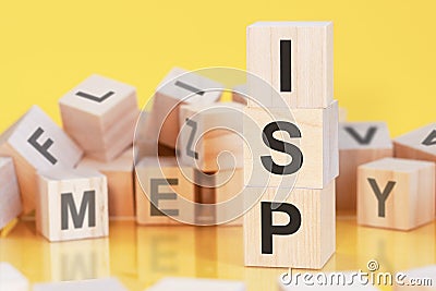 Word ISP from wooden blocks with letters, concept Stock Photo