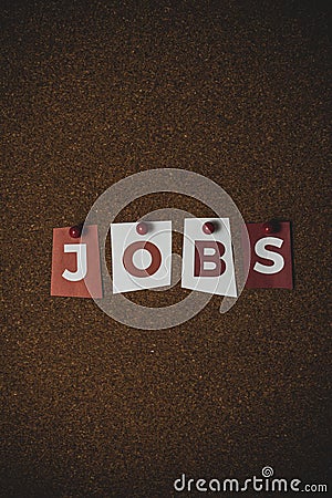 The word Jobs written on colorful note papers on board background. Employment concept. Job search Stock Photo