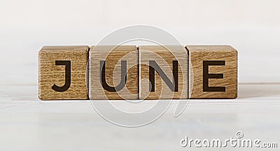 The word June on wooden cubes. Concept Month of year Stock Photo