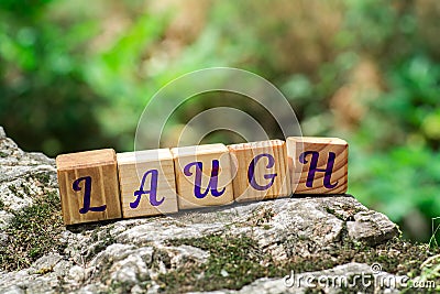 Word laugh on stone Stock Photo