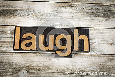 Laugh Letterpress Word on Wooden Background Stock Photo
