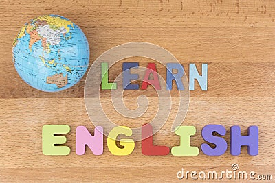 Word learn english with globe over wooden background Stock Photo