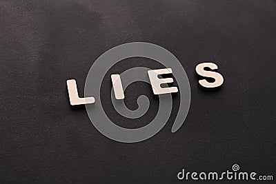 Word Lies on black background Stock Photo