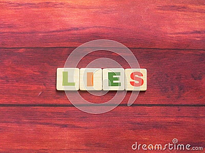 Word Lies on wood Stock Photo